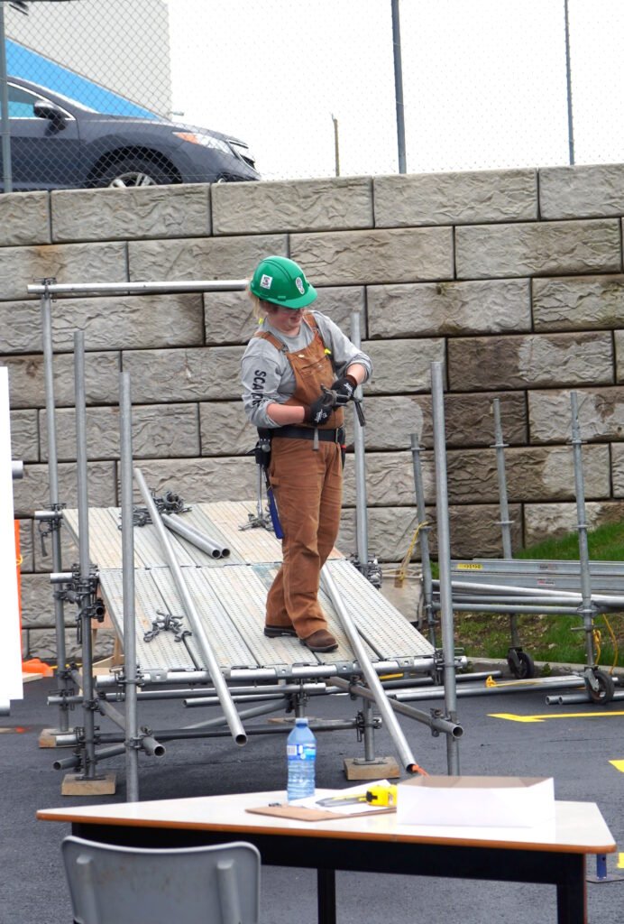 woman building scaffolding